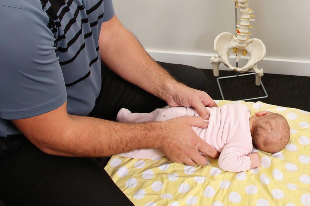 baby getting gentle chiropractic adjustment