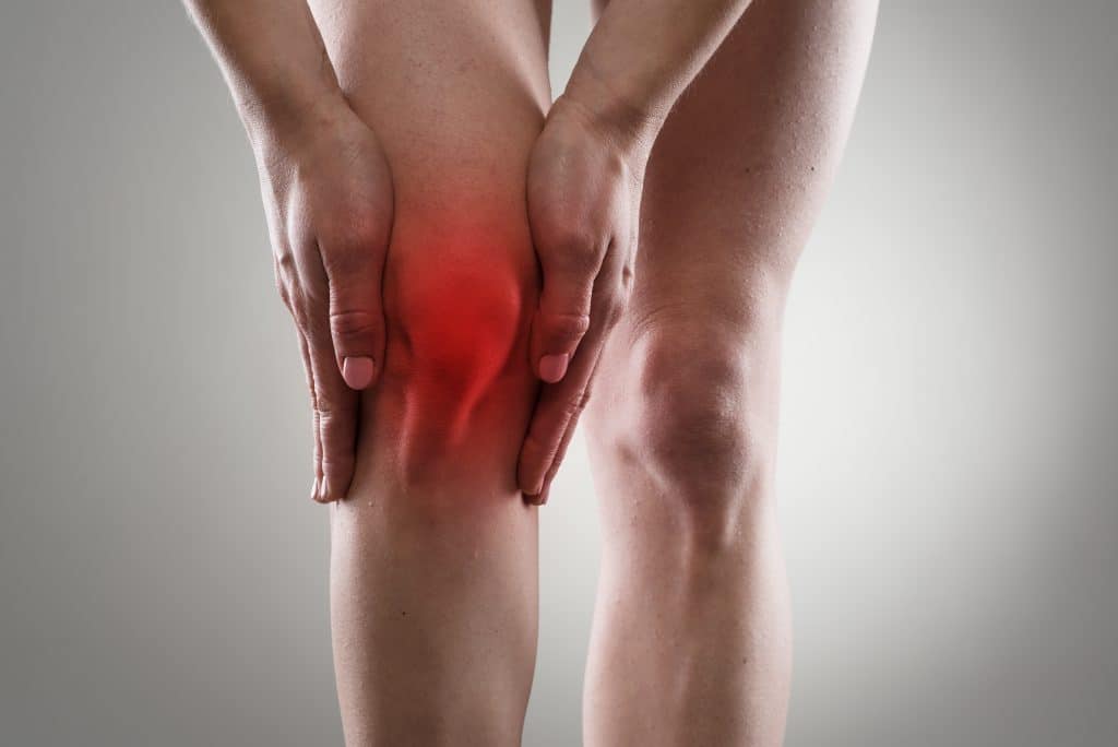 person with knee pain image