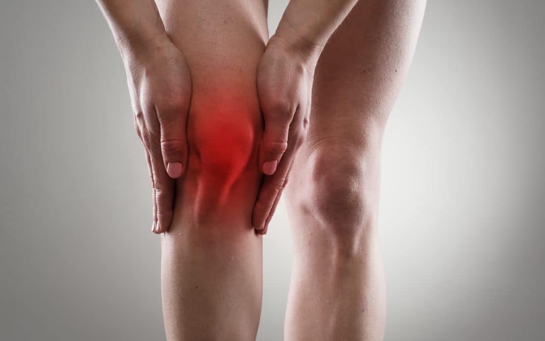 person with knee pain image