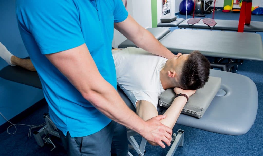 sports chiropractic thumbnail guy getting adjusted