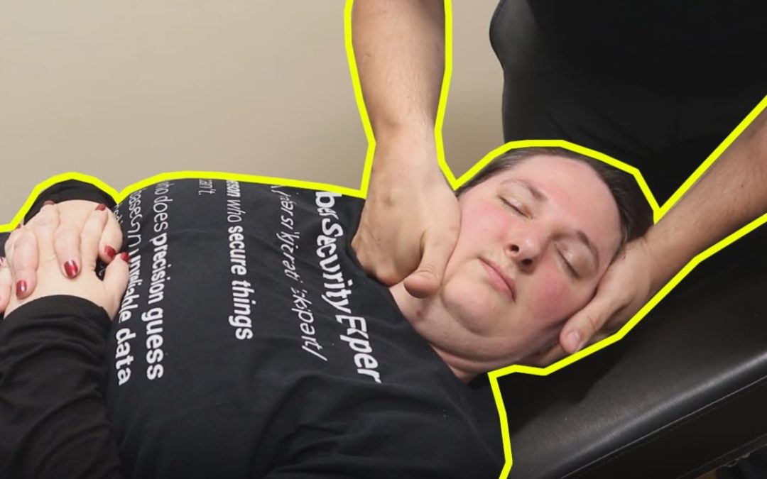 women in black shirt who is a tech worker gets chiropractic adjustment