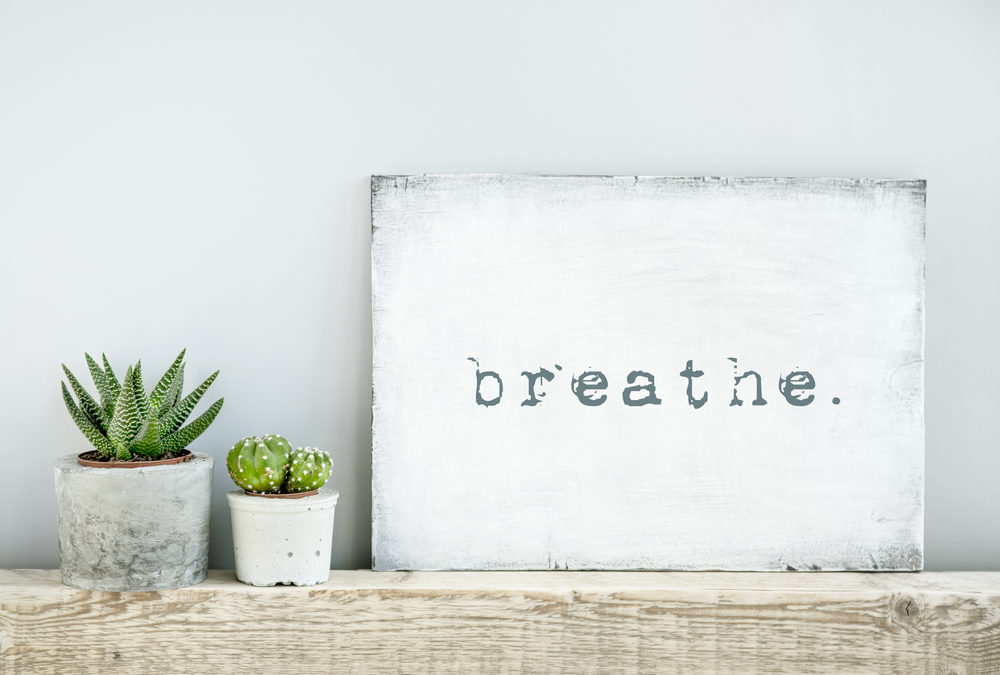 motivational poster quote BREATHE. scandinavian or american style room interior.
